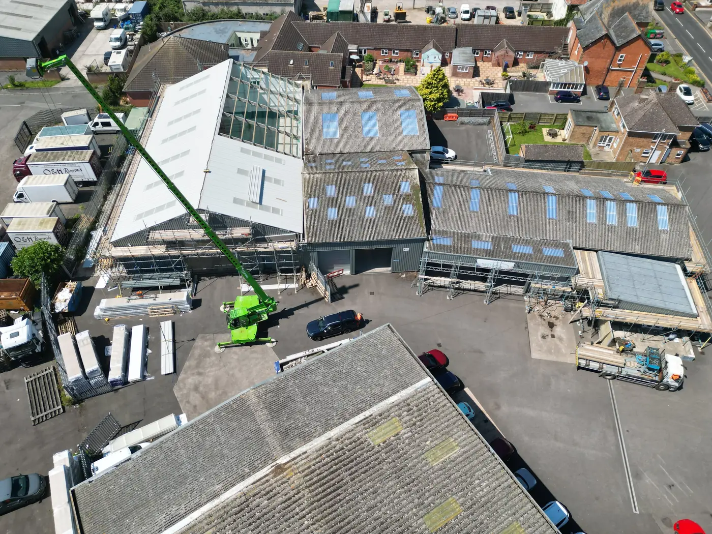 New roof panels being lifted into place by crane