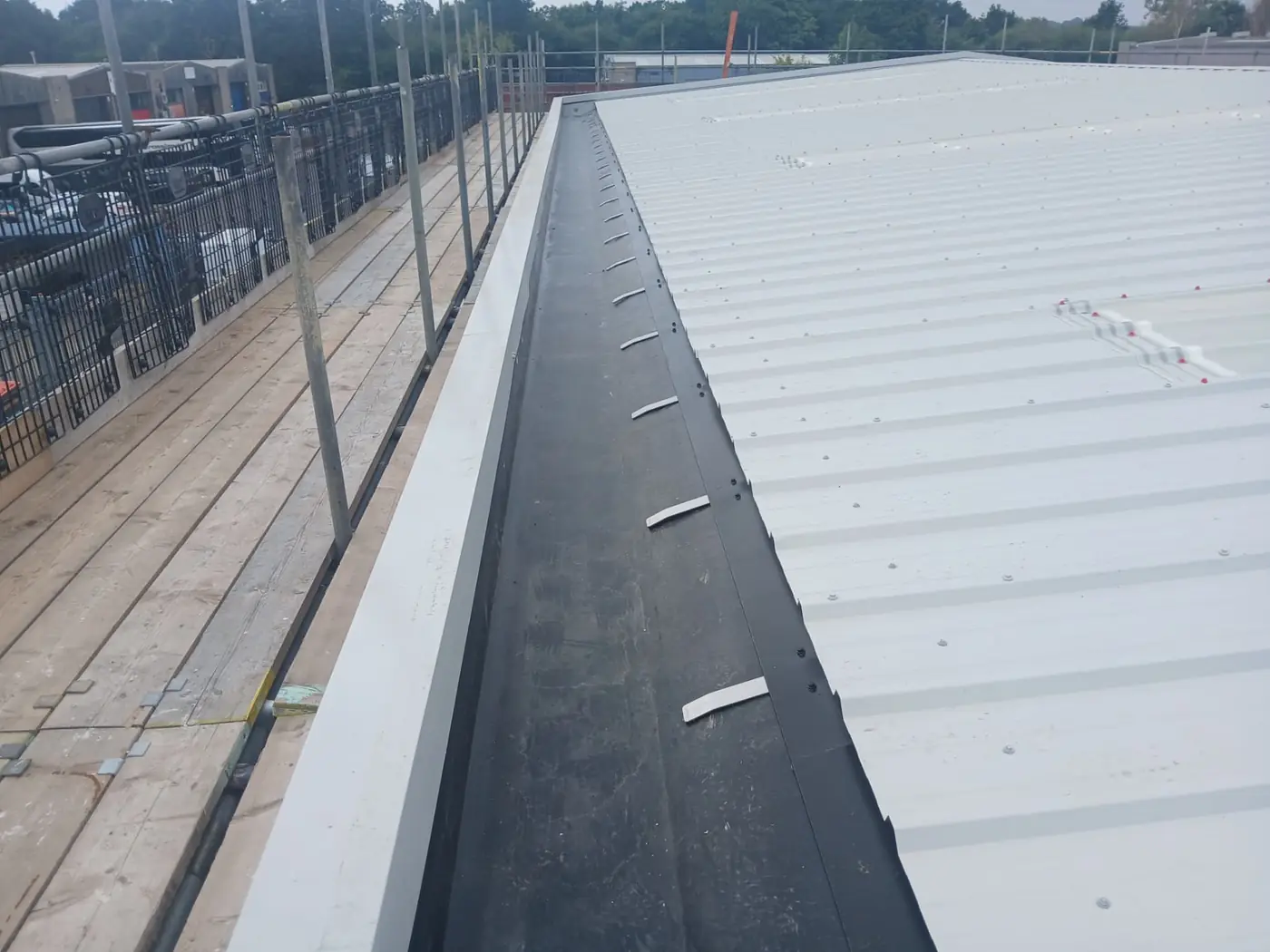 Relined internal valley gutter beside the new roof