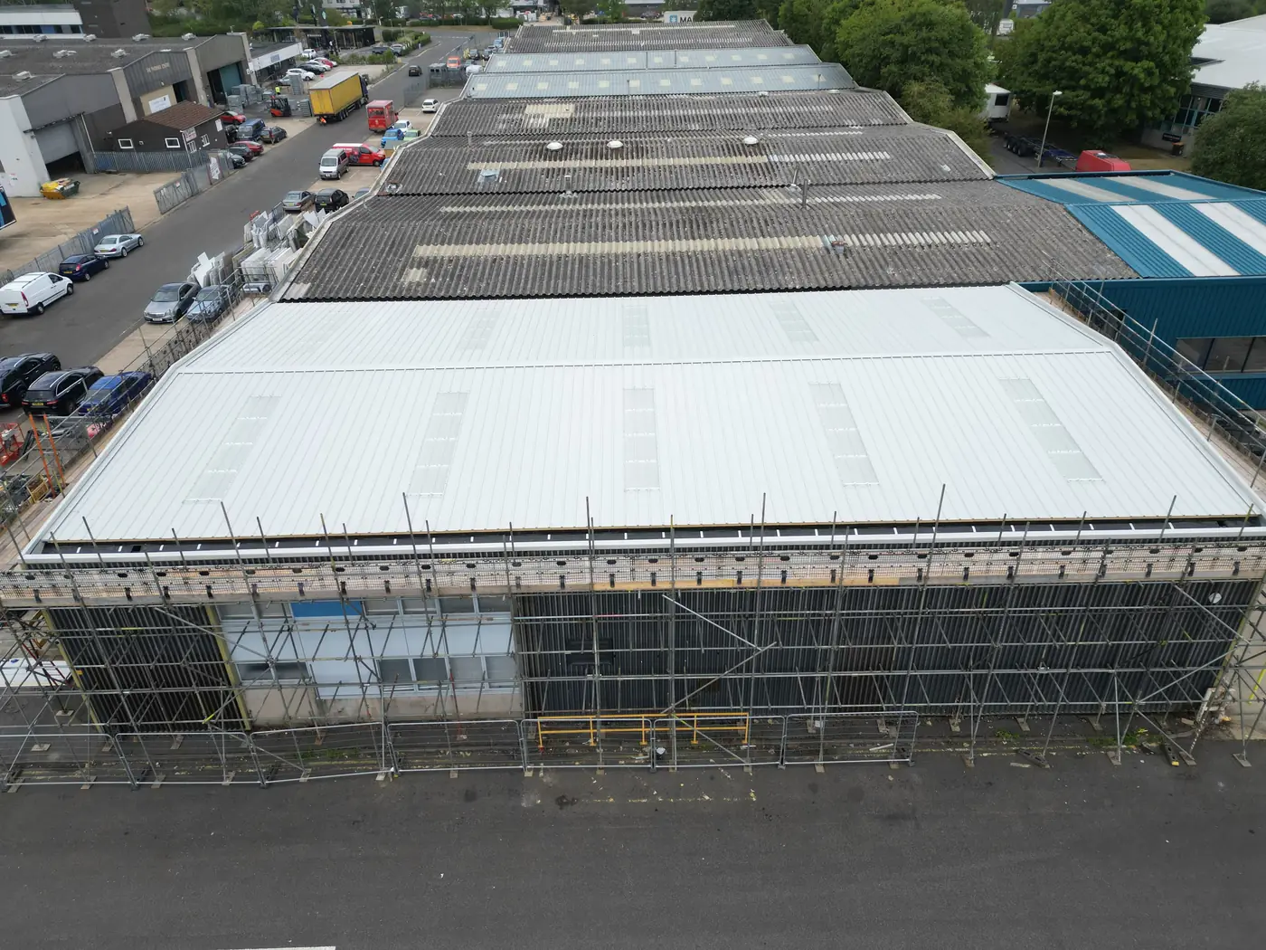 The building on a restricted industrial site, with scaffolding along the street