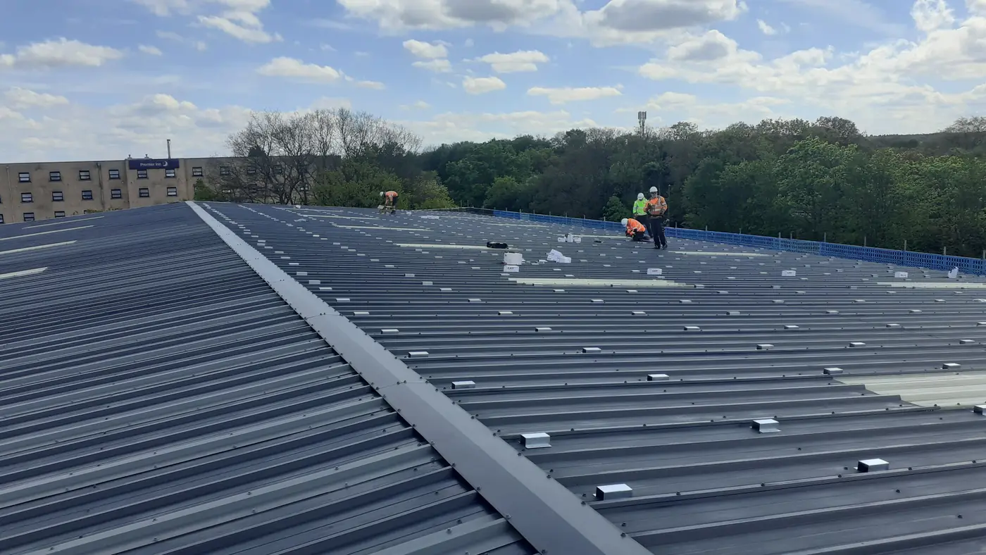 New roof sheets being installed