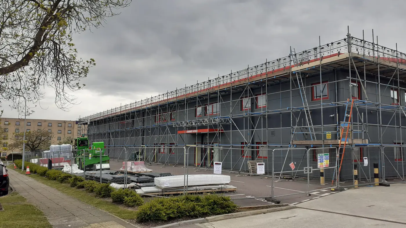 The building in Stevenage with scaffolding during the overclad