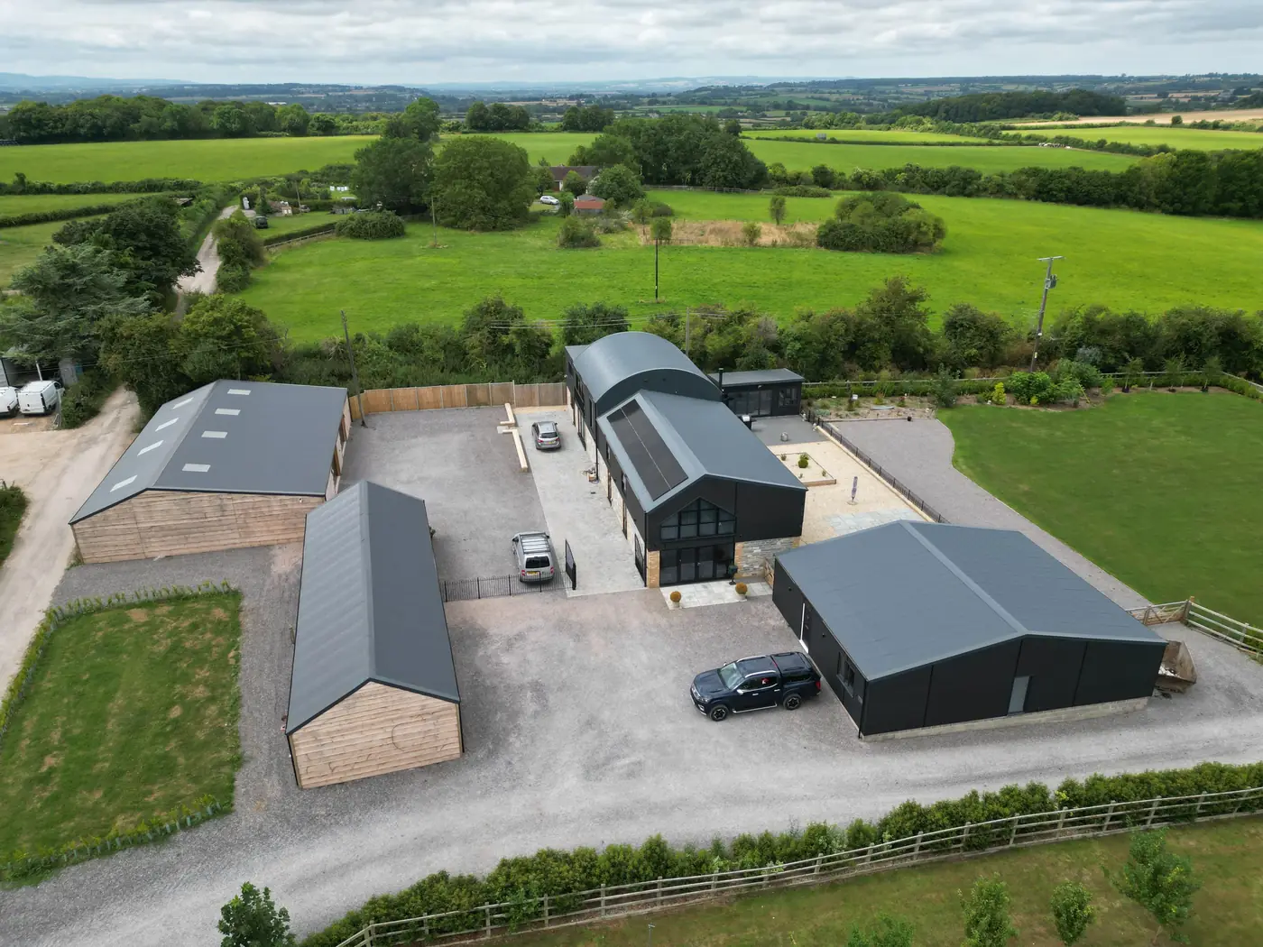 Aerial view of the converted barns, garages and outbuildings at Stoney Ridge Farm