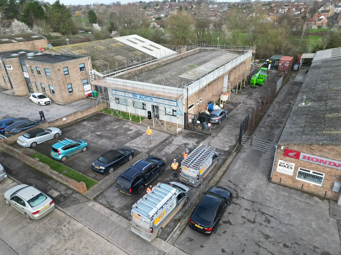 Scaffolding around the building before the roof strip